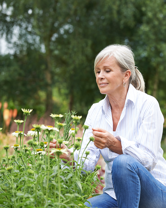 A volunteer helping in the garden